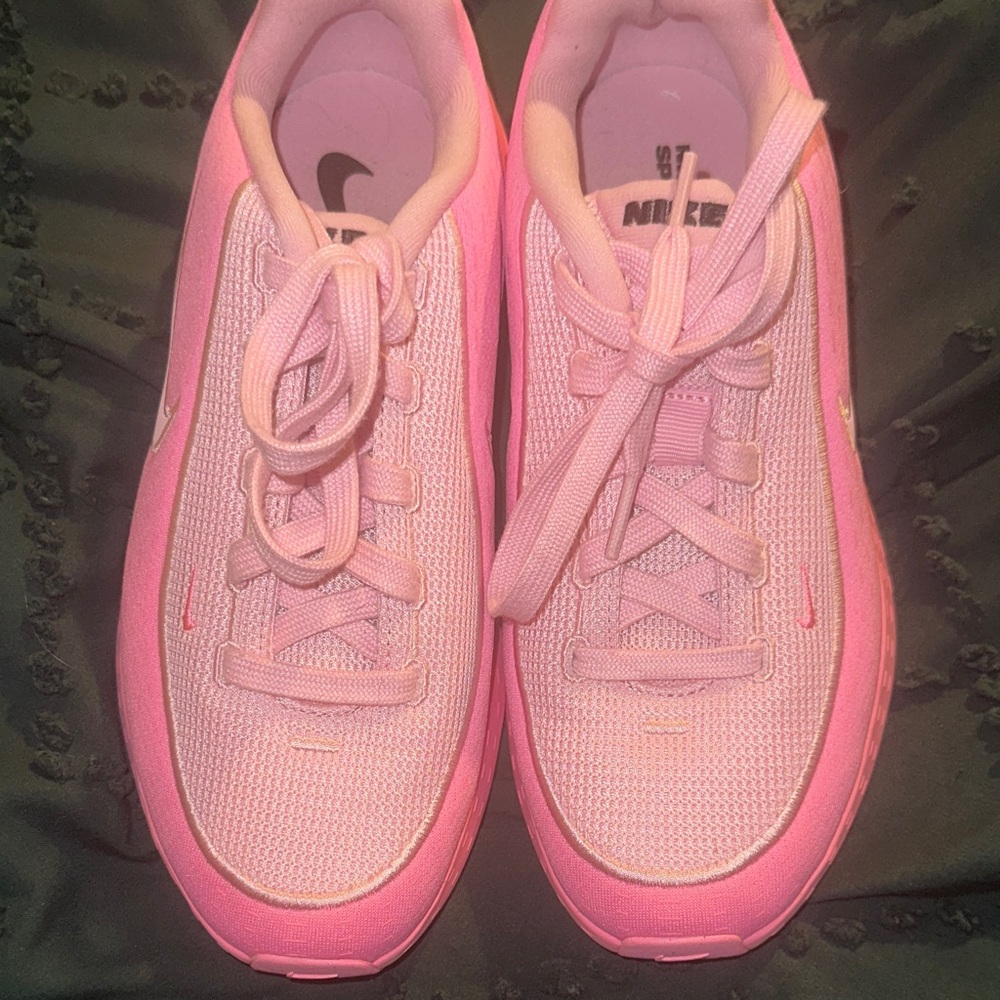Nike Uplift SC sneakers in a pink colorway.